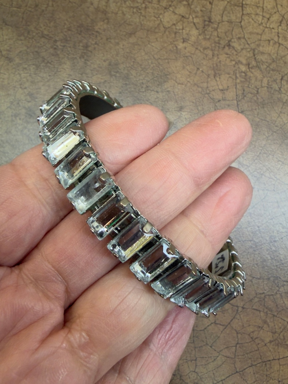 Silver tone emerald cut stone bangle